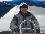 Rob motoring from Mallard Cove to race, cold and windy..