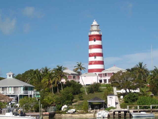 Hope Town Lighthouse, keeper's cottage, 120 ft high, built 1863, five lenses, 325,000 candle power.