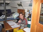 Jan Bryson, down below catching up on school work, Nov 16, 2008, aboard Wild Blue Yonder