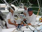 Who invited Robert aboard? Billie and John Middaugh and Robert Banks on Slippery II..