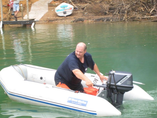 Dave Bryson taking people boat on buoy line to shore