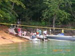 People coming ashore to Pig Roast site