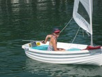 Sandra Little sailing dinghy in harbor of Lake Shore Marina..
