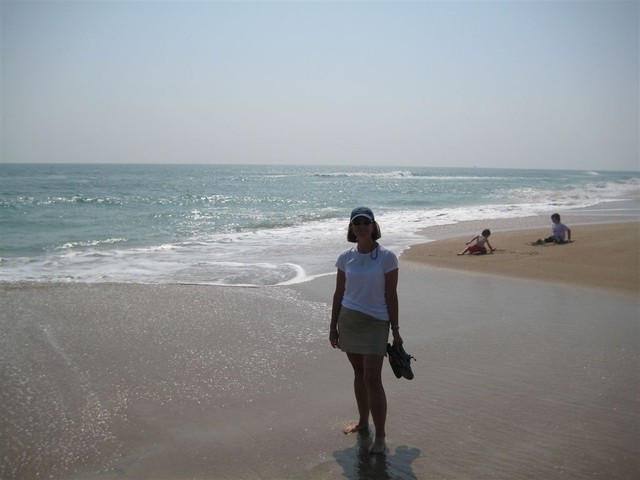 Sandra on beach at Cape Lookout, surf out..