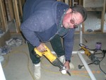 Greg Johnson installing plumging, Nov 23 (Picture from C. Lucas)