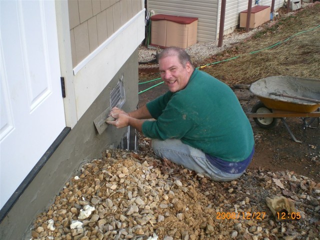 Putting stucco on block wall, Dec 27 (Picture by C. Lucas)