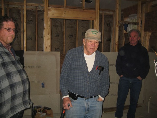 foreman whipping crew into action to install Hardy board to support tile, Sat Jan 3, 2009